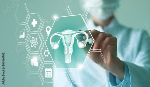 Fototapeta Unrecognizable female doctor holding graphic virtual visualization model of Uterus organ in hands. Multiple virtual medical icons.