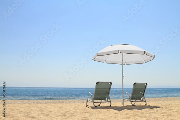 Obraz Umbrella and lounge chairs on idyllic beach