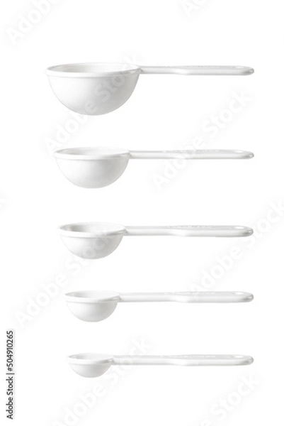 Obraz White measuring spoons isolated on a while