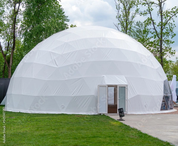 Fototapeta White mobile dome design. Outside spherical glamping dome. Hemispherical structure lattice shell geodesic polyhedron. Camping house hotel party tent. Folk accommodation park outdoor leisure recreation