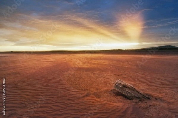 Obraz Sunset, Beams in the sky of Khakassia Oglakhty mountains. reservoir without water, sandy ripples, clay and hills, rainy sky over Mount Tepsey Tepsei