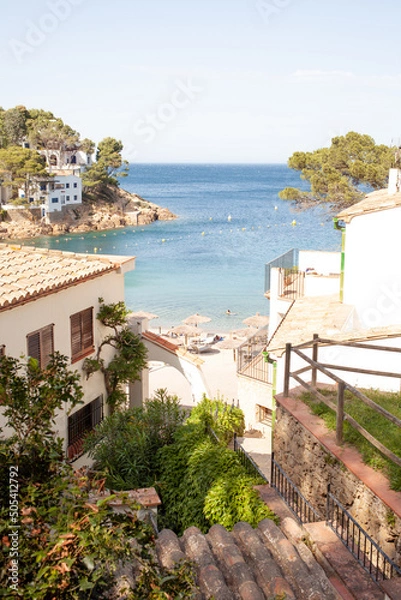 Obraz Small beautiful town on Mediterranean sea coast with beach view and clean transparent blue water surrounded with mountains and pine trees. Amazing place to have happy summer vacations