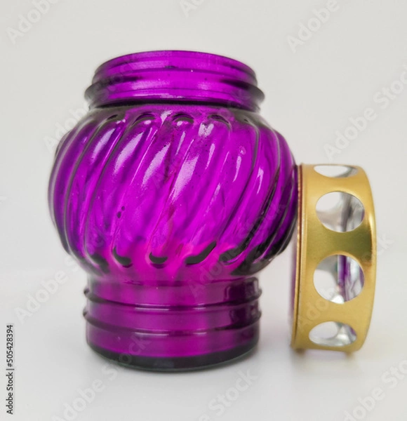 Fototapeta An unquenchable lamp made of purple glass. Candle for the grave with a lid. A memorial candle. A memory candle.