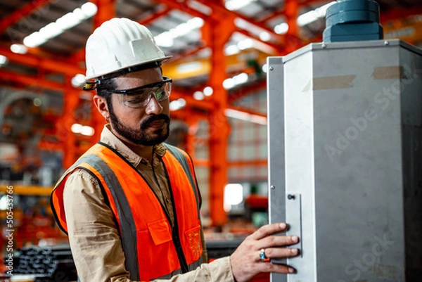 Obraz Electrician engineer tests electrical installations and wires on relay protection system. Bay control unit. Medium voltage switchgear	
