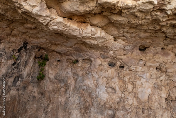 Obraz Places  for lamps in the remains of the buildings of the ancient settlement on Mount Arbel, located on the coast of Lake Kinneret - the Sea of Galilee, near the city of Tiberias, in northern Israel