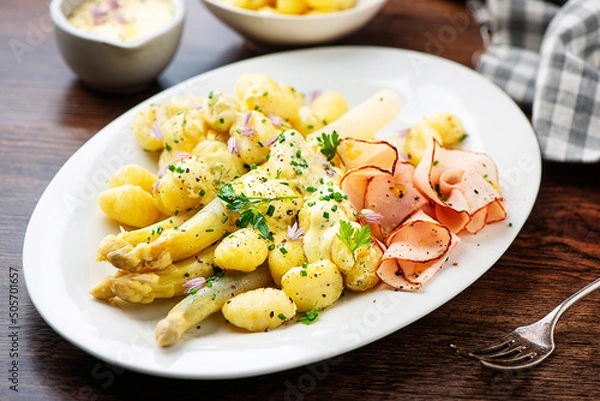 Obraz White asparagus with ham, Dutch sauce and gnocchi