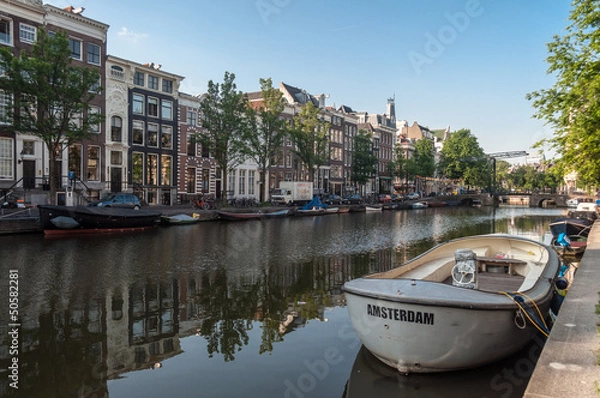 Obraz Anchored boats in one of the canals in Amsterdam, Netherlands