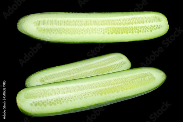 Obraz Long green cucumber on black
