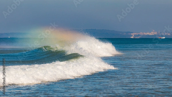 Fototapeta rainbows over waves on the sea