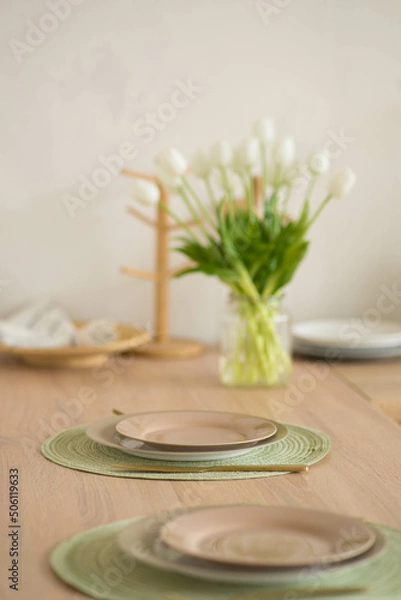Obraz two plates stand on a table on a stand