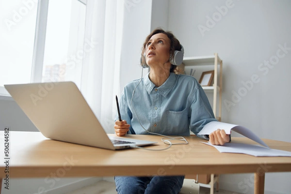 Fototapeta Upset angry tired call center operator curly awesome lady experiencing professional burnout working from home online communication with clients. Young woman hates her work need psychological help. 