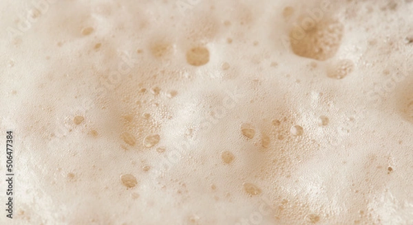 Fototapeta Beer foam top view. Soft fresh Foam on light beer. Bubble froth of beer. Beer foam texture background