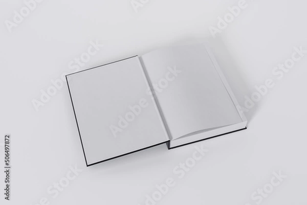 Fototapeta Mockup of a rectangular open on the first-page book with a blank, black glossy cover on white background. Isolated with clipping path.