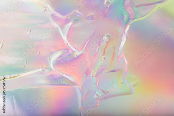 Fototapeta Abstract cosmetics gel on holographic background.Good as cosmetic banner.