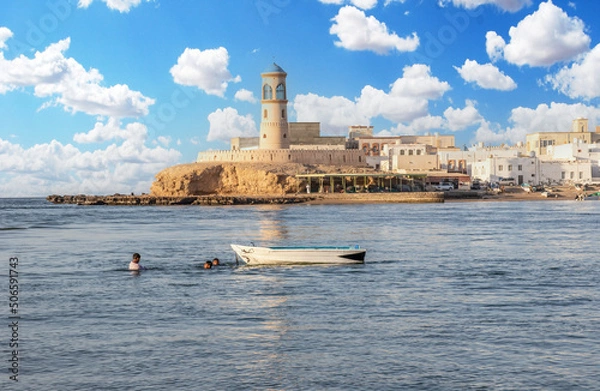 Fototapeta Sur, Oman - an important point for sailors and famous also for its building wooden ships, Sur is a pearl of Oman, with its fusion of green waters, white buildings and red rocks