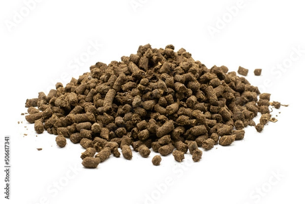 Obraz Bulk pelleted manure on a white background.