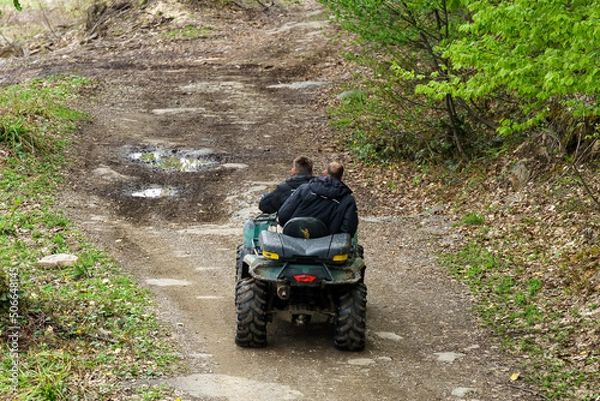 Obraz two men riding ATV in mountains
