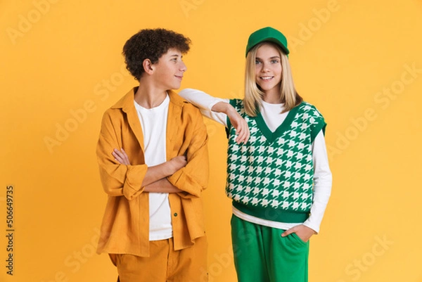 Fototapeta White two teenagers smiling while posing together