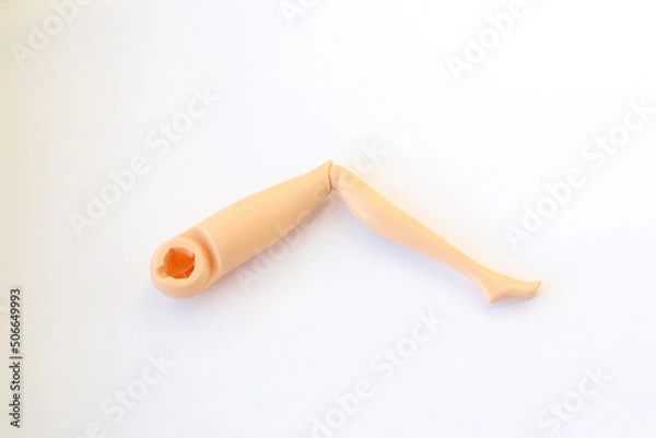 Obraz Leg from a doll. Plastic detail from Barbie doll. Broken toy.