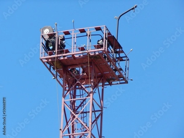 Fototapeta Lighting tower. Platform with spotlights on top of the metal tower.