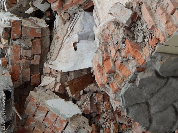Obraz Fragments of a brick wall. Ruins of a demolished house.
