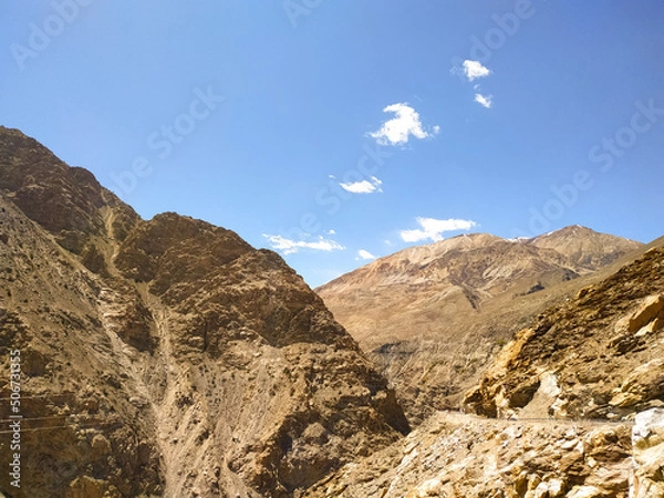Fototapeta Beautiful sand mountains with blue sky and clouds