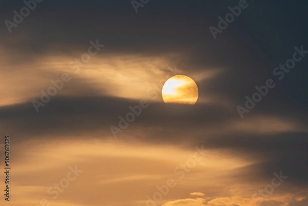 Fototapeta sunset with reflections and cloudy sky