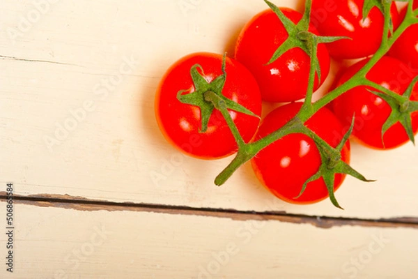 Obraz fresh cherry tomatoes on a cluster