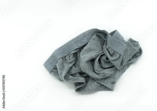 Obraz Isolated men's underwear on white background, throw away used underwear on the floor, top view image used men's underwear, gray color.