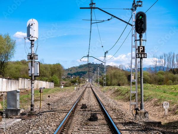 Fototapeta High luminous railway signals located in the middle of the track and their corresponding ASFA beacons