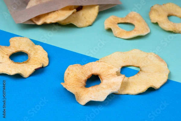 Obraz Dried apples on a blue background