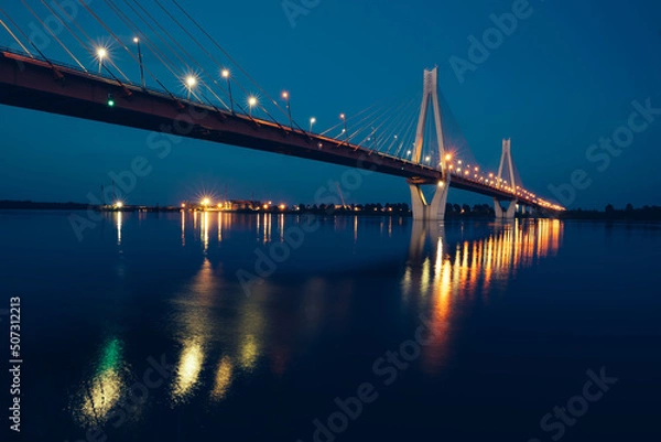 Fototapeta night glowing bridge over the river