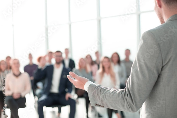 Obraz image of a speaker giving a lecture at a business seminar