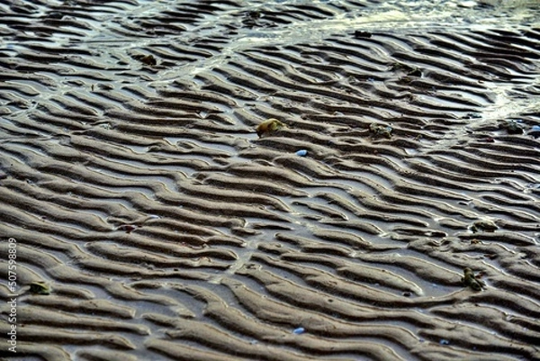 Obraz Wavy sand pattern background, Sea waves crashing against the beach.