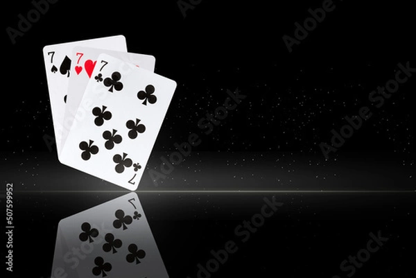 Obraz Three sevens. Playing cards, on a black background. Copy space. Reflection Poker Gambling