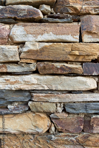 Fototapeta Rectangular stone wall in ocher tones