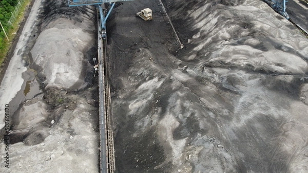 Fototapeta Aerial shot of a large ash dump created by burning a large amount of coal. Located near the city center