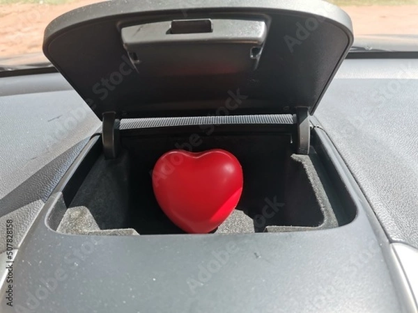 Obraz red heart in the car compartment