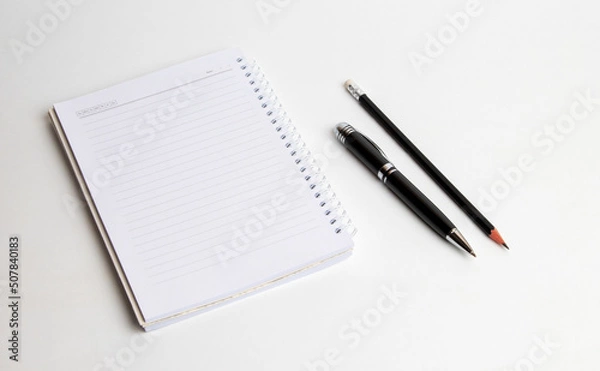Fototapeta blank notebook with pen and pencil on white background, business concept
