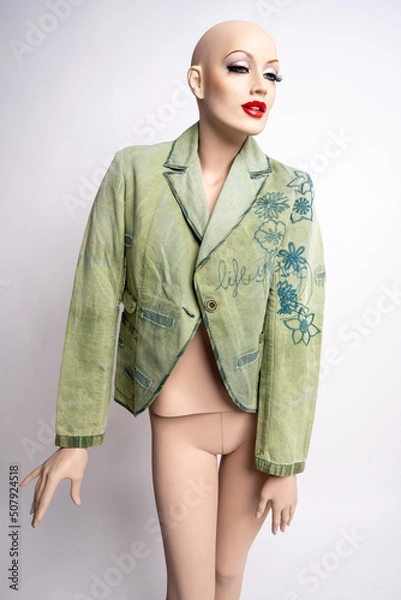 Obraz Schaufensterpuppe mit grüner Jacke