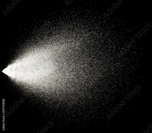 Obraz Sprayed water. Splashes and drops of water isolated on black background.