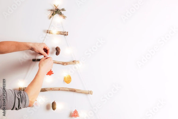 Obraz hands holding christmas tree