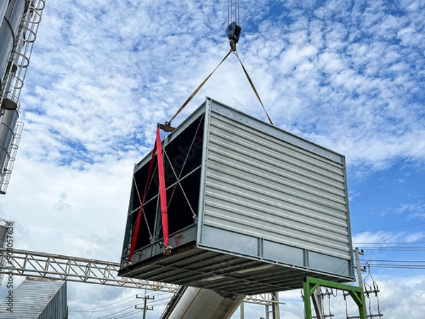 Fototapeta Lift and move the new cooling tower system to install.