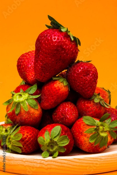 Obraz Fresh strawberries on orange background