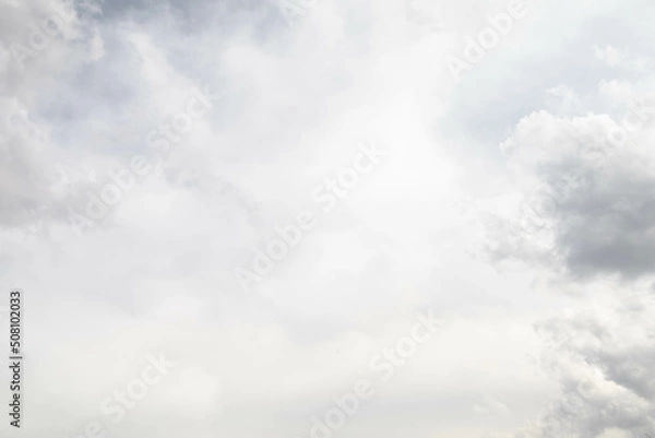 Fototapeta Cloudscape scenery, overcast weather above dull sky. Rainy clouds floating in the air with natural light. White and grey scenic environment background. Nature purity view.