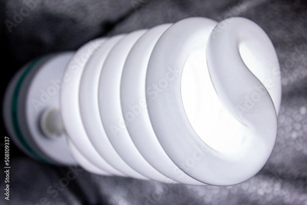 Fototapeta LED light bulb close-up. LED lamp on photo lighting.