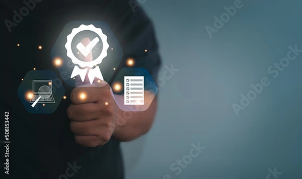 Fototapeta Businessman thumbs up to show signs, quality assurance, warranty, product and service standards, ISO certificates, surveys, customer databases. Concept of standardizing products and services