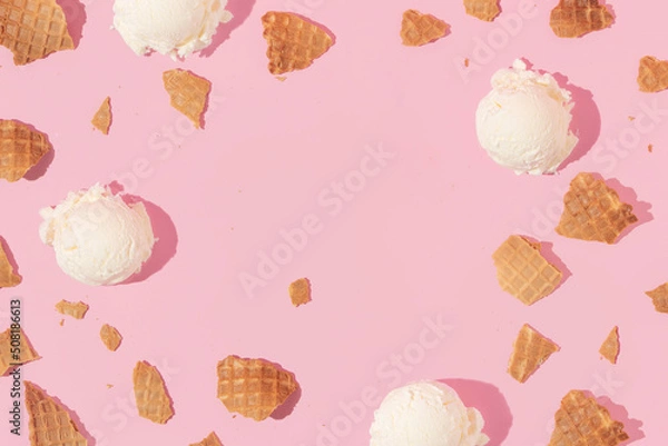 Fototapeta Summer creative layout with broken ice cream cone pieces and ice cream scoops on pastel pink background. 80s or 90s retro fashion aesthetic ice cream and scoop concept. Minimal  summer idea.