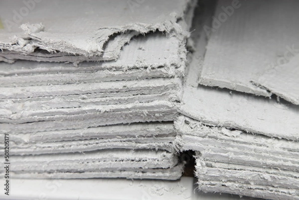 Fototapeta Asbestos sheets in stack - effective insulator for construction