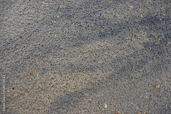 Fototapeta a background of fine sand and small rocks
